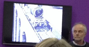 London Book Fair. Andrew Davidson, seen here with a photo of his etched cover for the most recent Harry Potter covers. The new designs, all by Andrew, are aimed at an older reader.